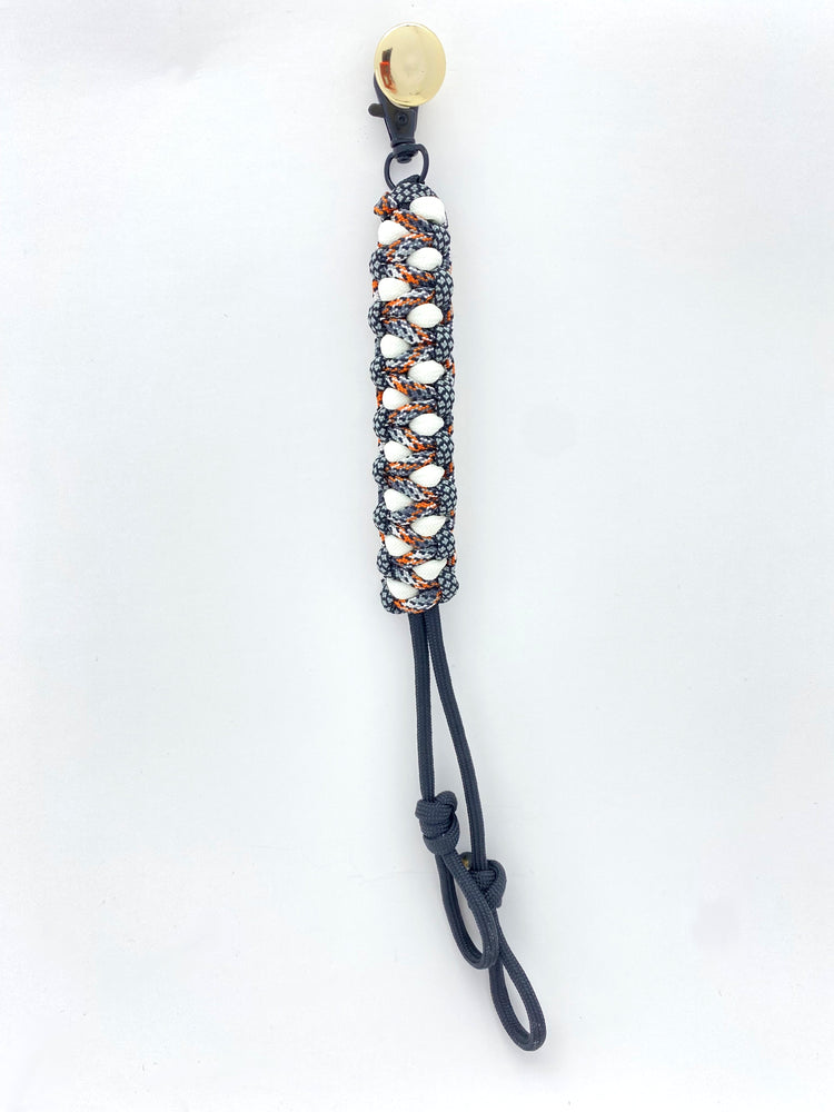 a clip with two additional loops for a game call lanyard