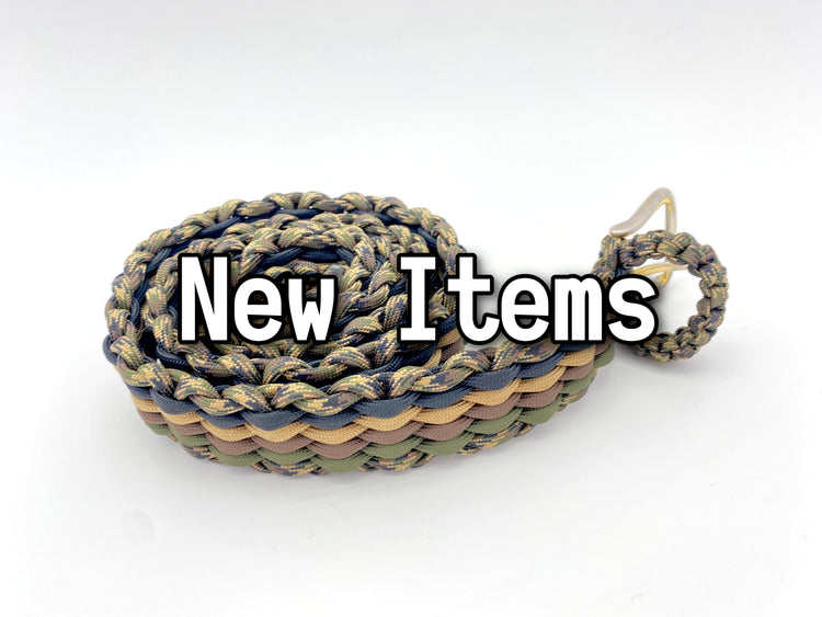 a woven belt made with various camo colors of paracord with the words "new items" over it