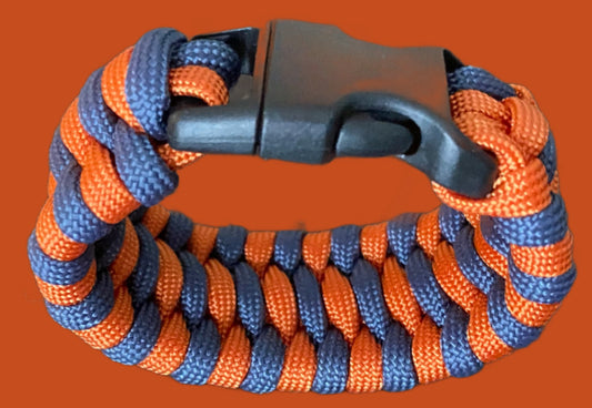 a trilobite paracord bracelet done in navy and orange