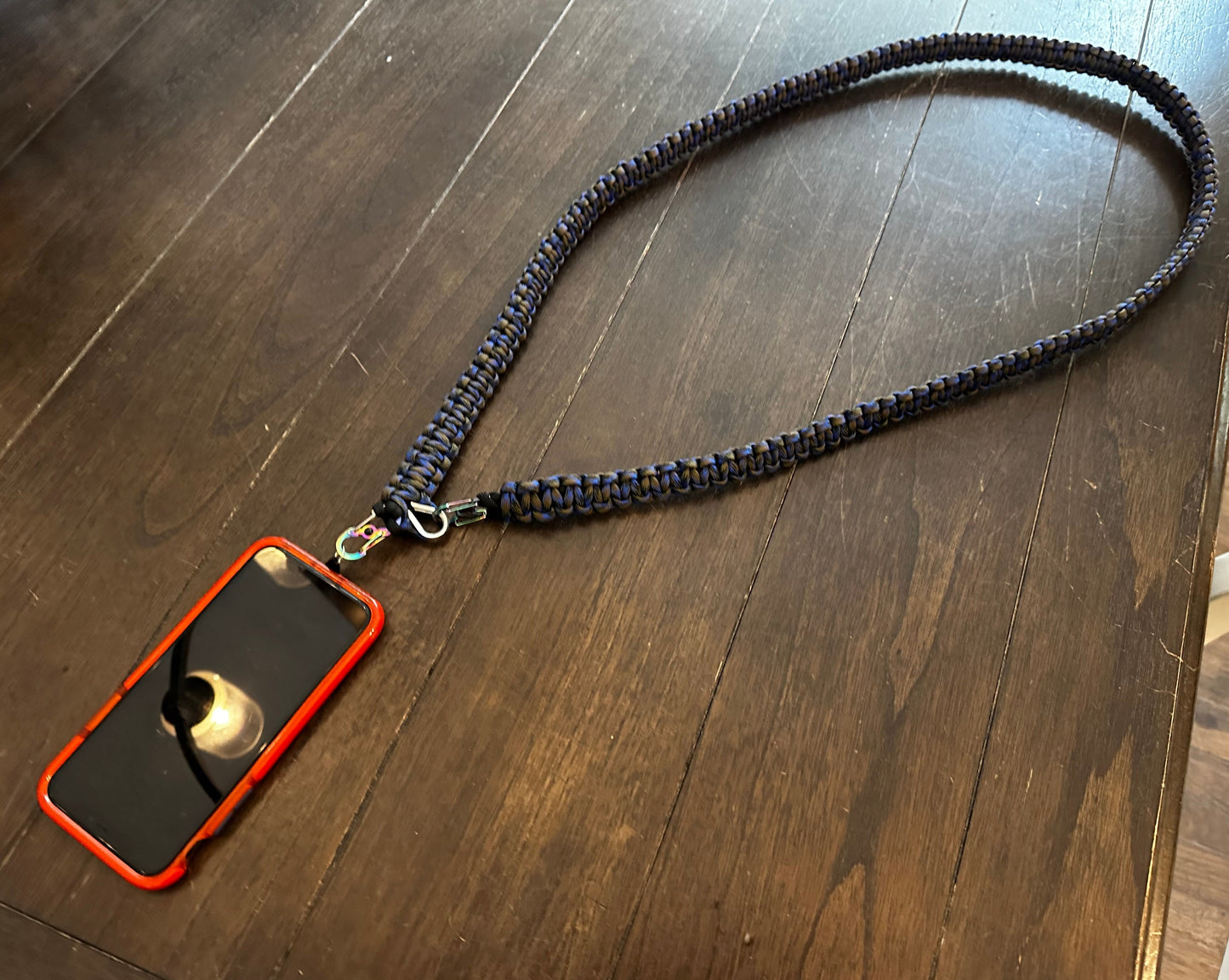 a cross body lanyard attached to a phone