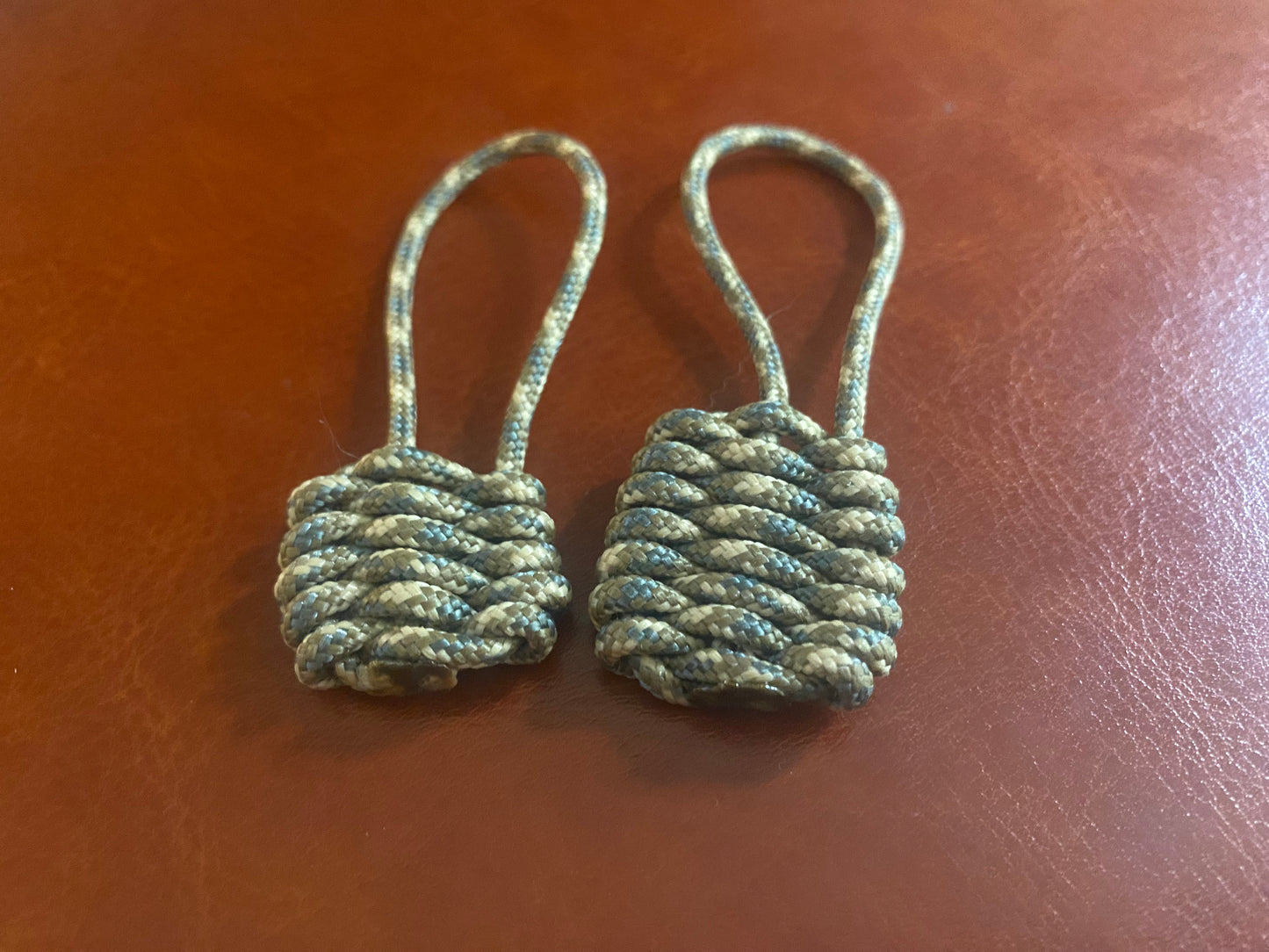 two zipper pulls made with camo 275 paracord