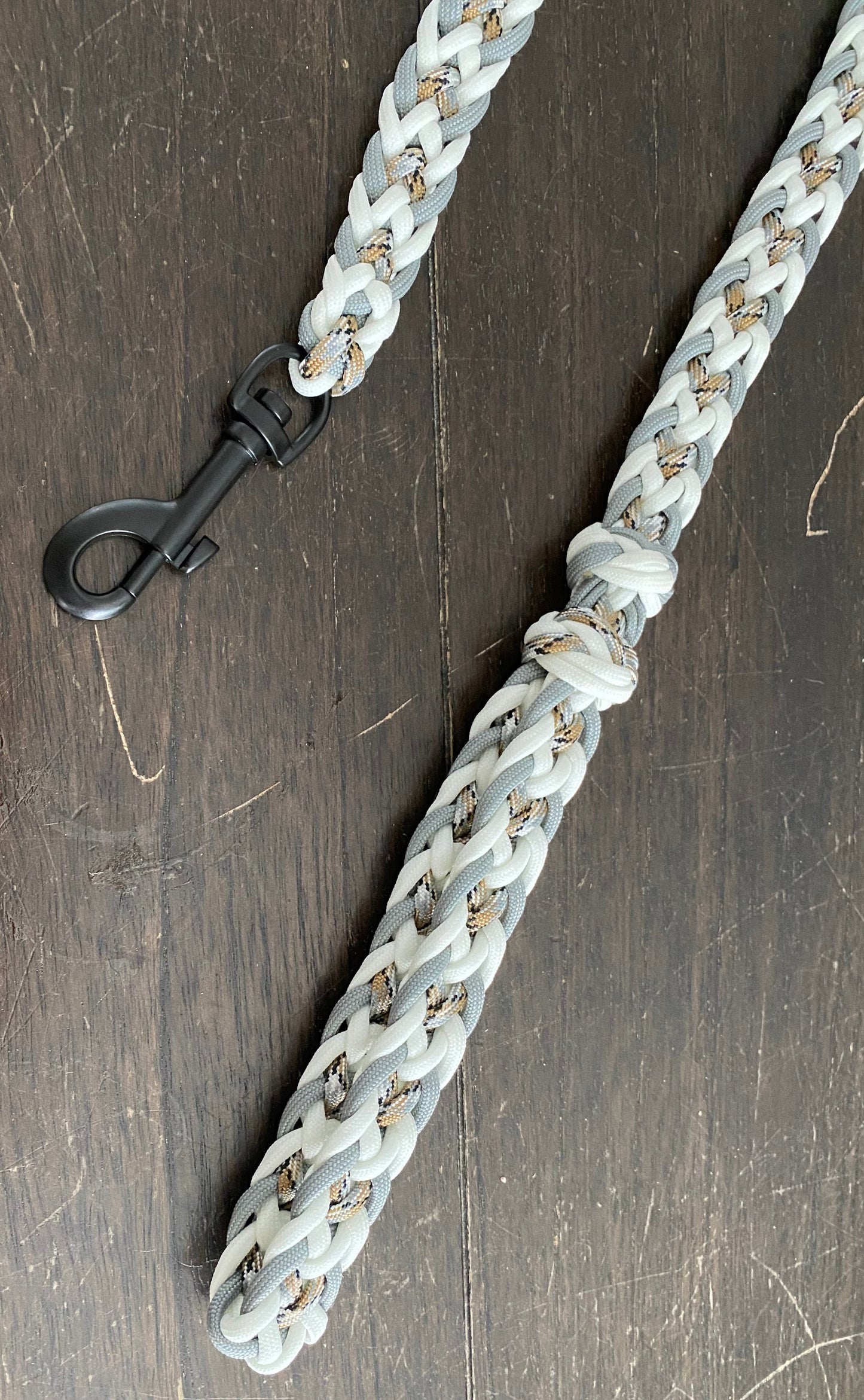 a dog leash made in the Japanese flat weave with white, grey, and desert camo 550 paracord
