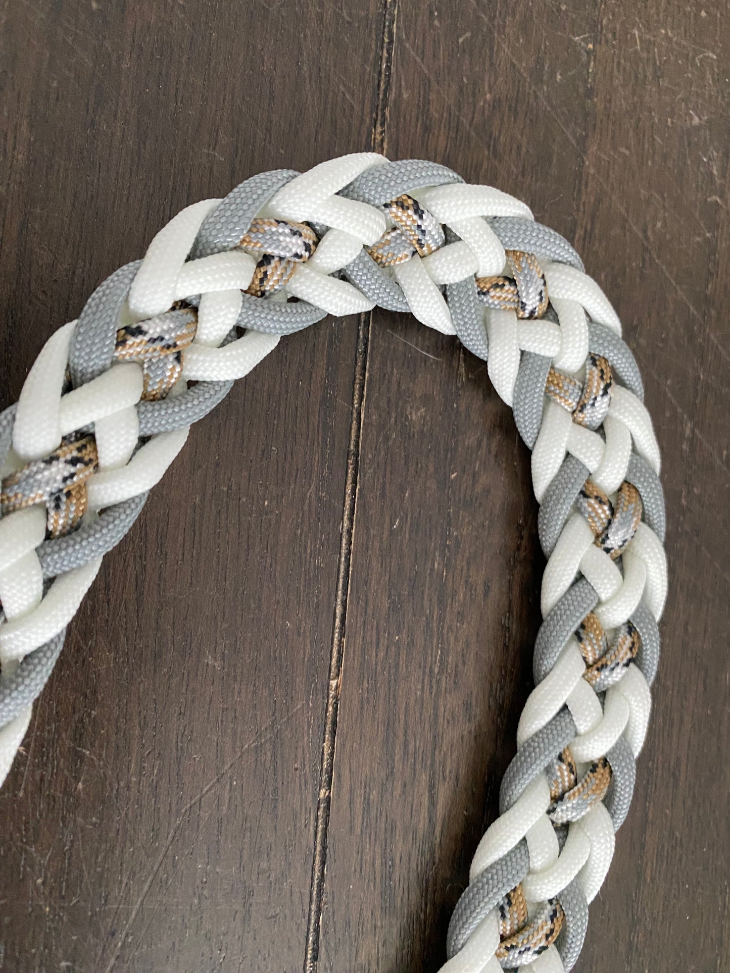 a dog leash made in the Japanese flat weave with white, grey, and desert camo 550 paracord