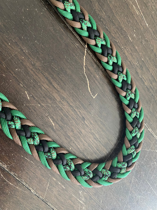 a dog leash made in the Japanese flat weave with green, black, brown, and green-patterned matching 550 paracord