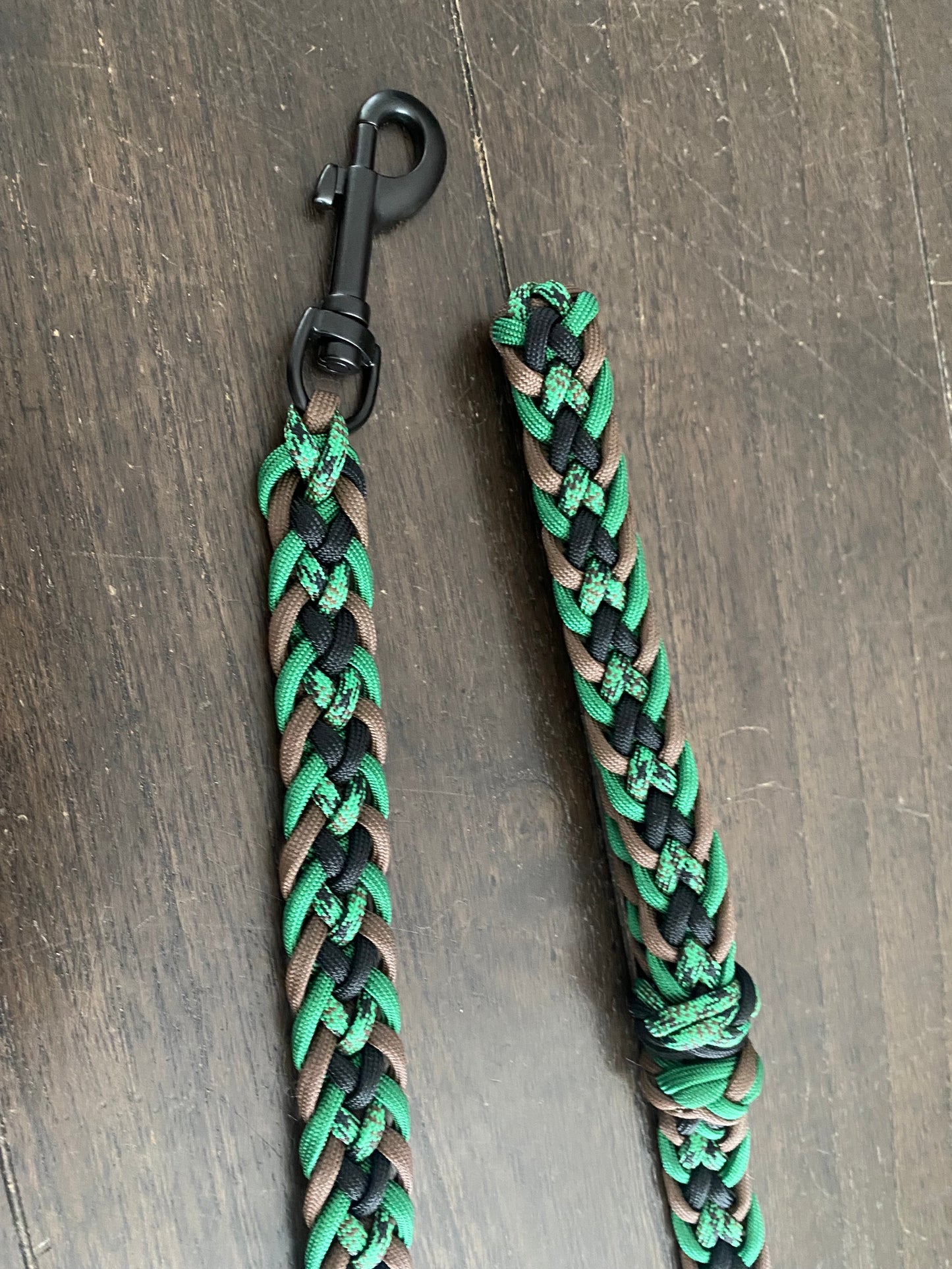 a dog leash made in the Japanese flat weave with green, black, brown, and green-patterned matching 550 paracord
