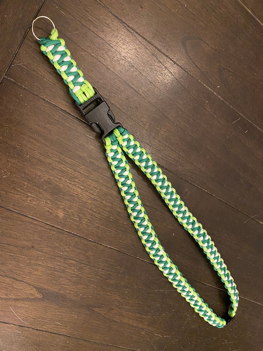 a general ID lanyard made in the soloman's dragon weave with green and white 550 paracord