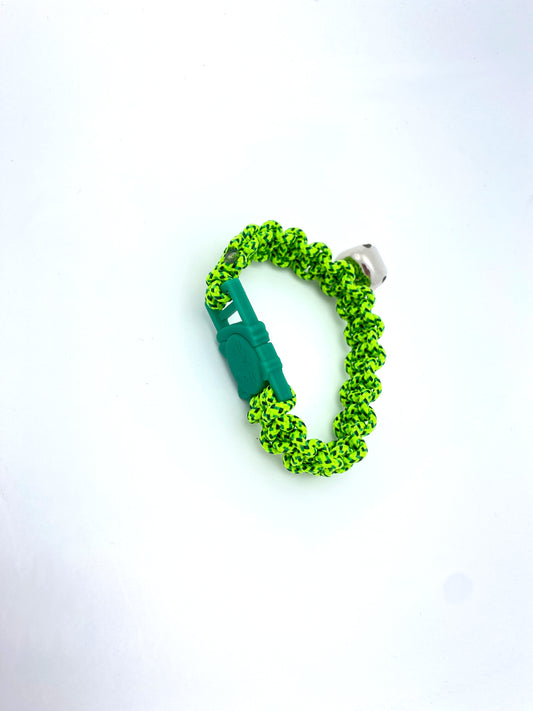 a cat collar made with a break away buckle, bell, and neon green and black paracord.