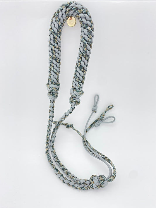 a handcrafted hunting lanyard for predator or prey calls built with grey and honor 550 paracord