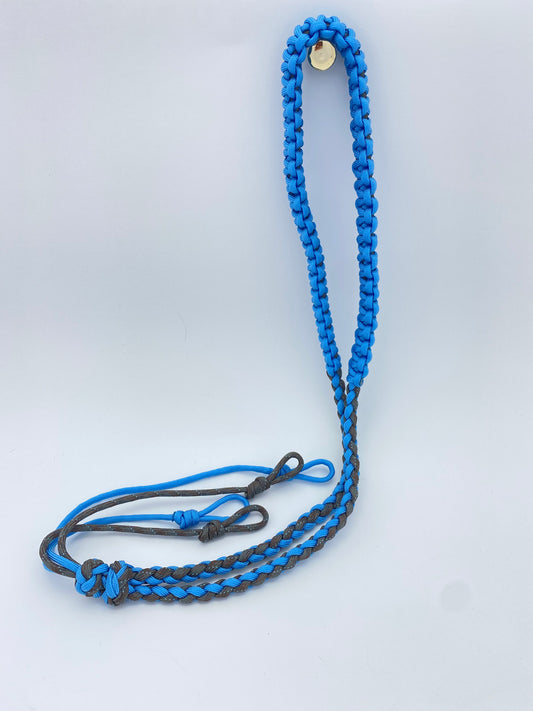 a handcrafted hunting lanyard for predator or prey calls built with grey and blue 550 paracord