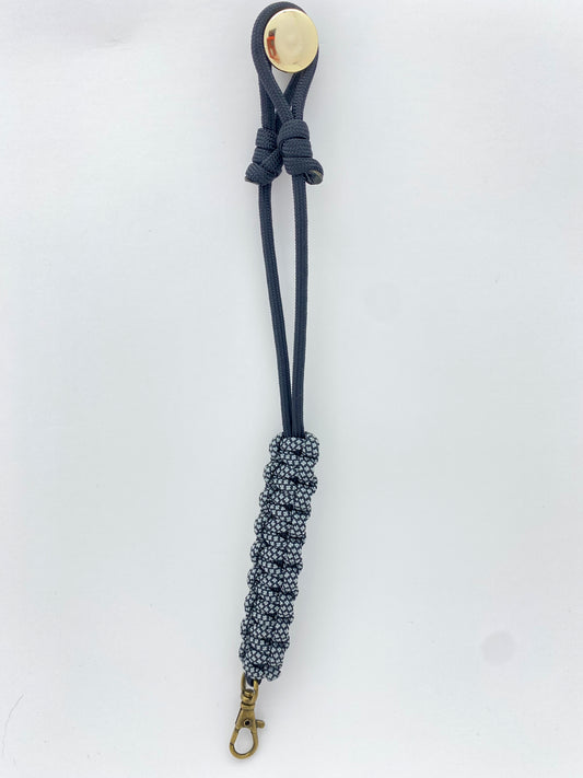 add on loops for a game call lanyard crafted in the cobra weave in black and gray diamonds