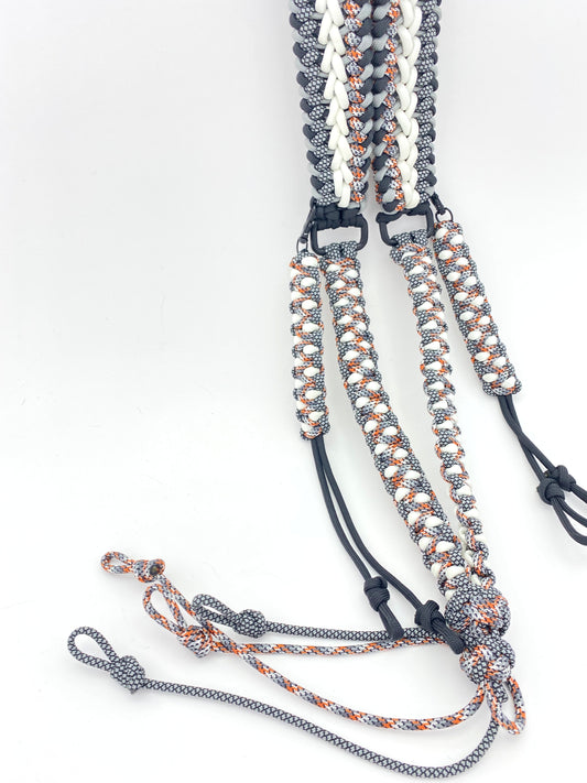 a game call lanyard built in the modified sanctified and soloman's dragon weave in black, grey, glow-in-the-dark, black and gray diamonds, and spy 550 paracord