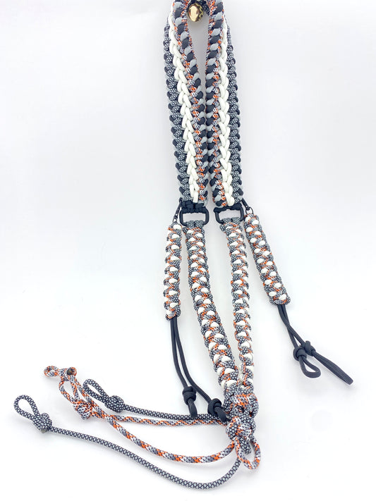 a game call lanyard built in the modified sanctified and soloman's dragon weave in black, grey, glow-in-the-dark, black and gray diamonds, and spy 550 paracord
