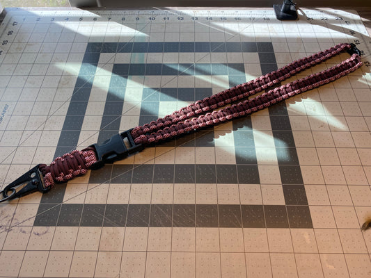 a tactical general lanyard crafted in the cobra weave with a dark red and burgundy color scheme