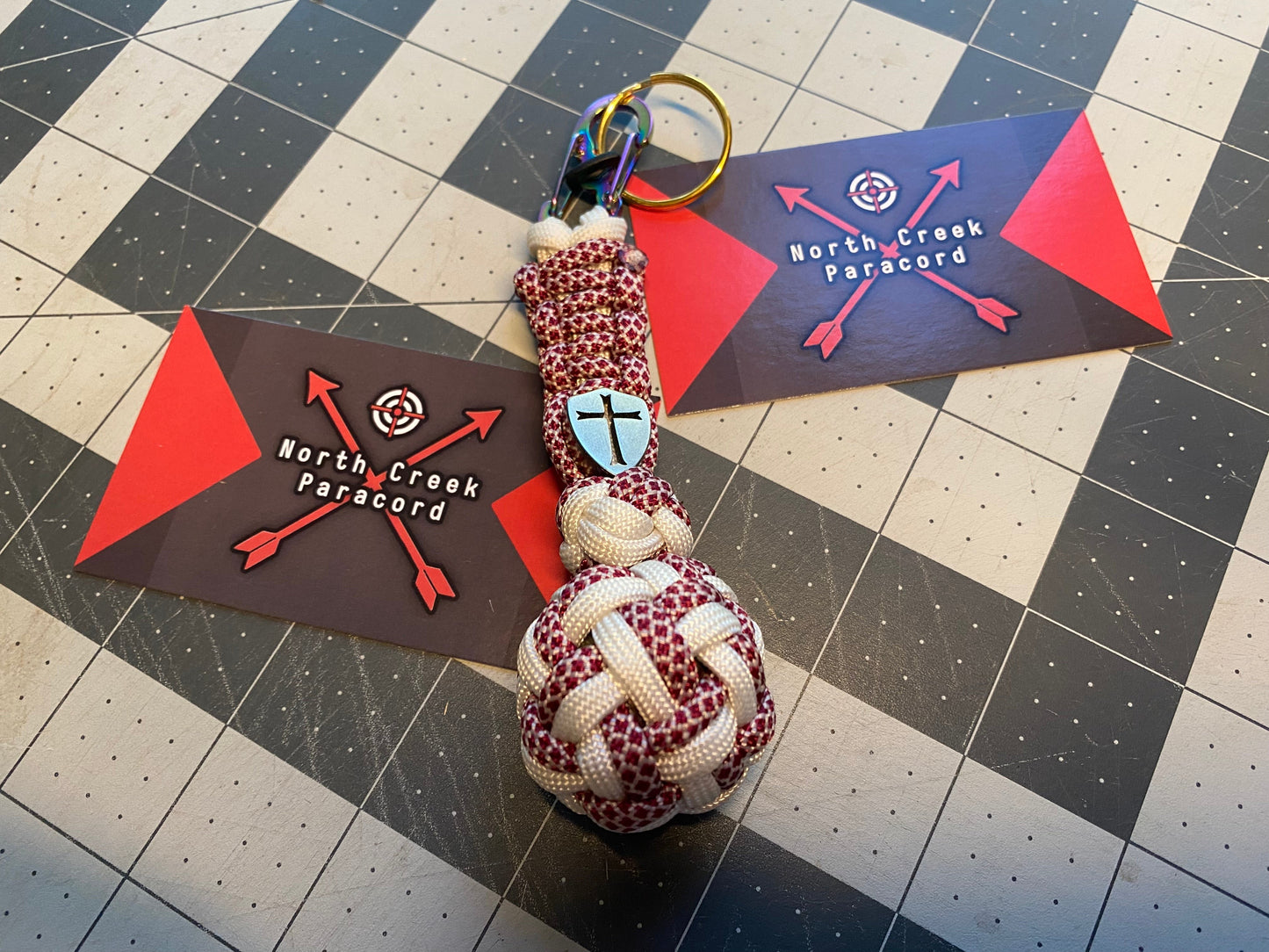 a key fob made with a lanyard bead and many fancy knots like a footrope knot and a globe knot