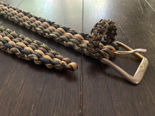 a paracord woven belt built in camo shades and a reclaimed metal buckle