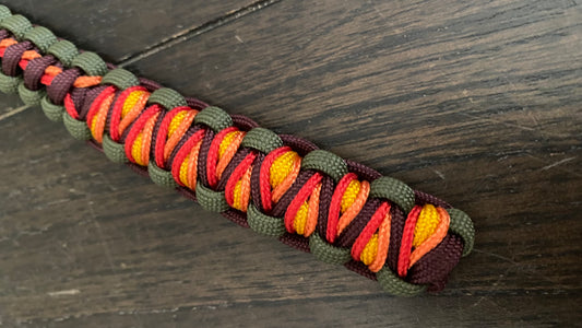 a key chain with stitching on the soloman's dragon weave