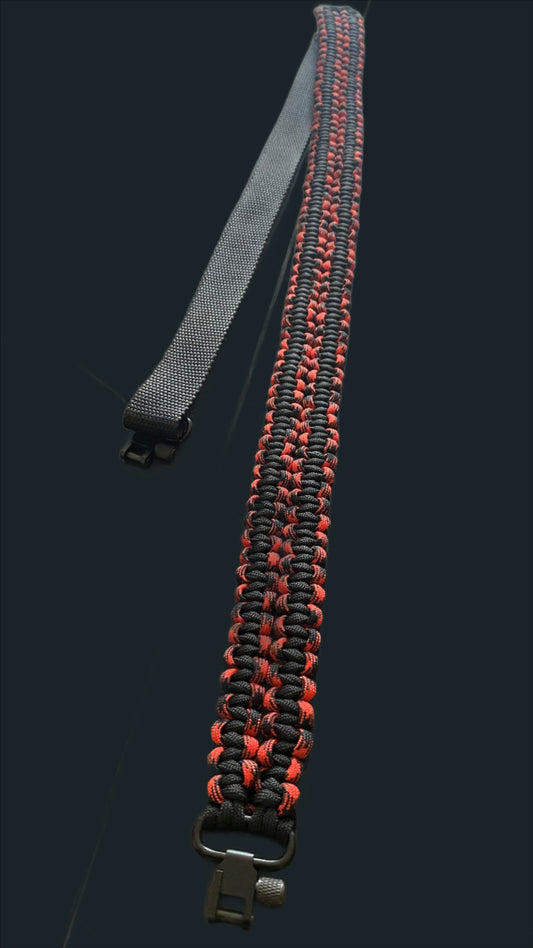 a black and red two-point rifle sling in 550 paracord