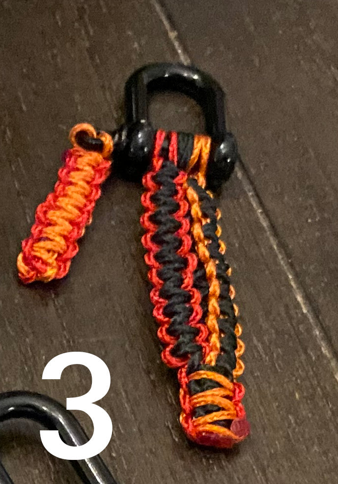 a mated cobra shackle keychain crafted in various colors of microcord.