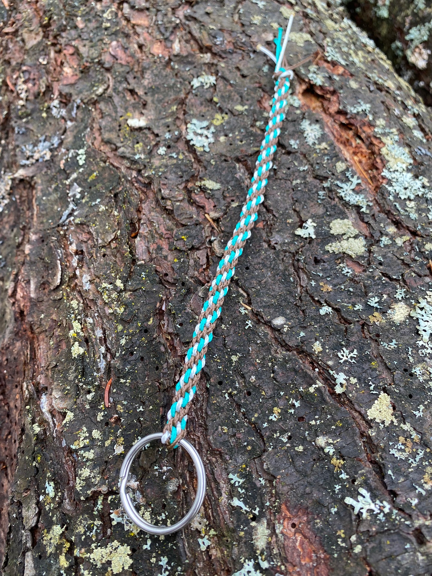 a key chain crafted in the Japanese round braid in microcord