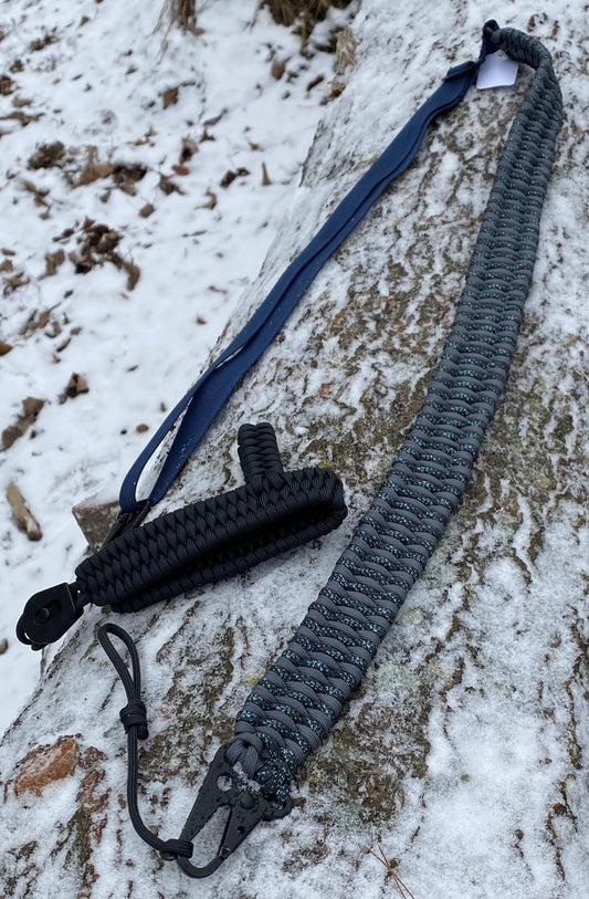 a trilobite drill-less rifle sling crafted with graphite and canis 550 paracord.