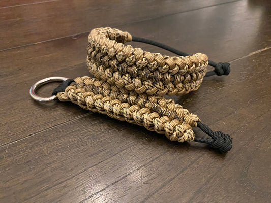 an adjustable paracord bracelet with matching keychain made in tan shades and black cord.