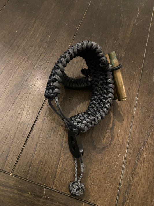 an image showing how wide a paracord stock holder opens to accommodate many stock sizes.