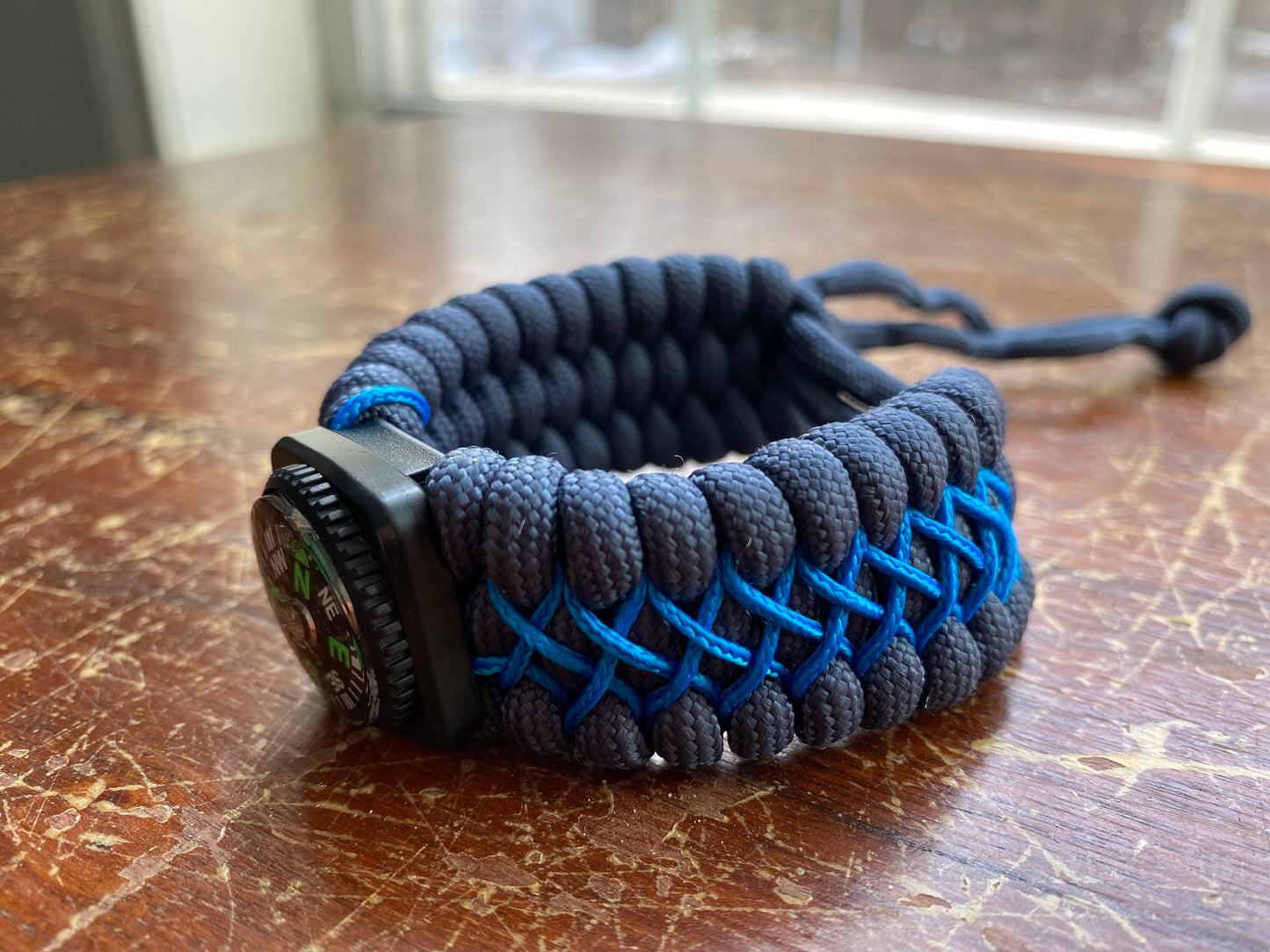 a stitched trilobite bracelet made to be adjustable.