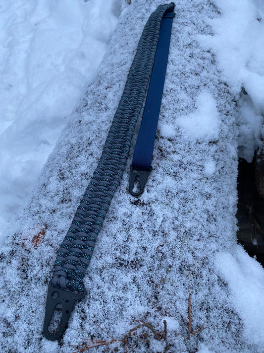 a rifle sling made with the trilobite weave in graphite and canis 550 paracord colors.