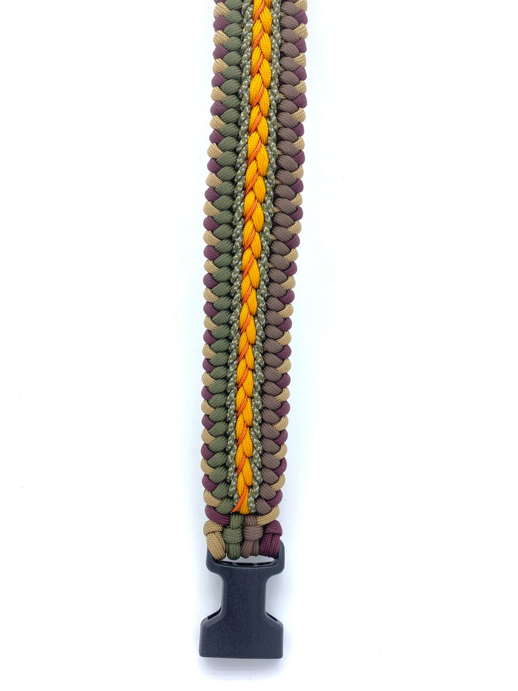 a fancy sanctified dog collar made with tan, maroon, gold, olive drab, and brown paracord with an additional three interweaves