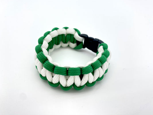 green and white paracord bracelet made with a 3/8-inch black plastic buckle