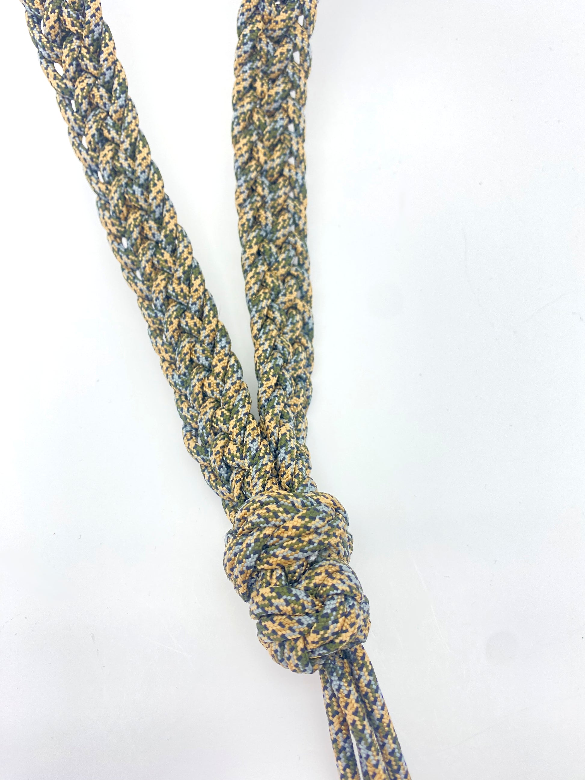 a close up of a game call lanyard made with waterfowl 550 paracord.