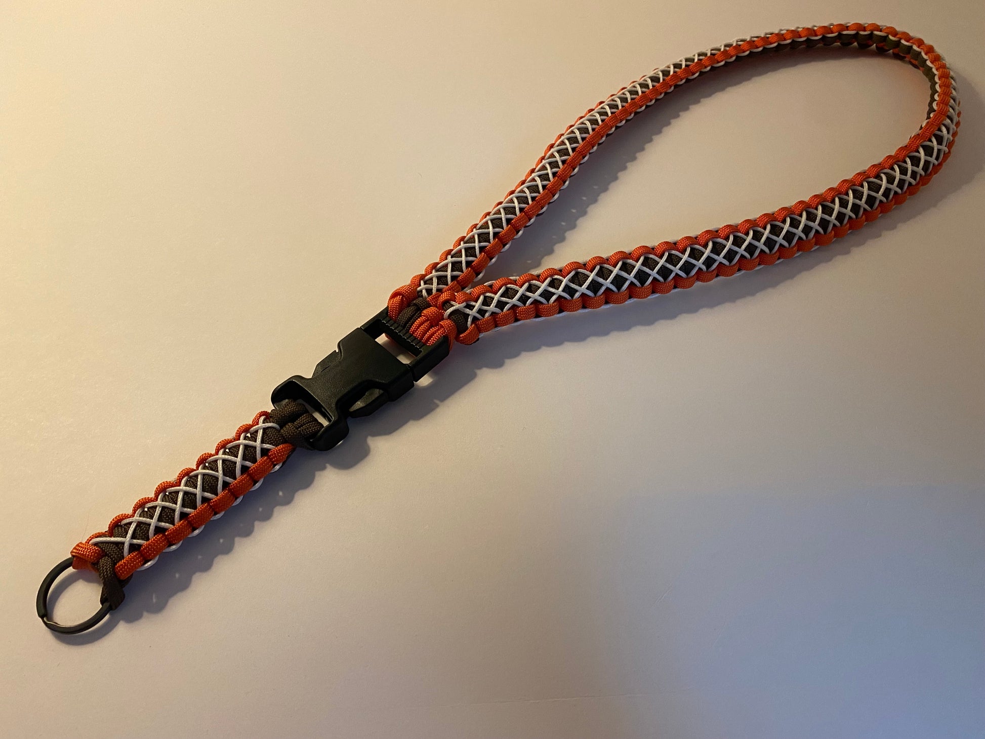 orange and brown 550 lanyard with glow-in-the-dark microcord stitching